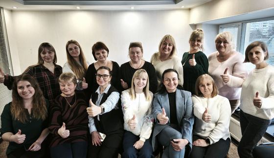 Teachers of intervention schools and Oksana (second from right, bottom), after learning how to implement the Can’t Wait to Learn Ukraine programme.