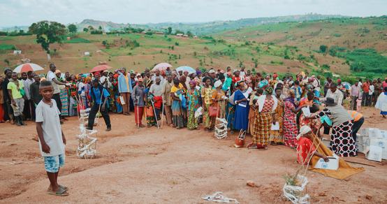 Boy Nelson looking at the line for supplies in Ugandan refugee settlement_Uganda_War Child_190917