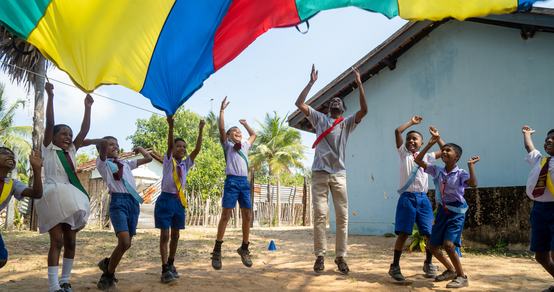 Children playing with the parachute in Sri Lanka_TeamUp_200226